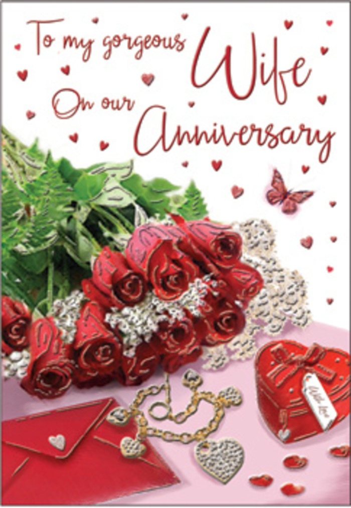 A rich, romantic tableau is set as if on a refined Mayfair dressing table, where a bouquet of classic red roses takes centre stage in this anniversary card design. Each rose is luxuriously full, the petals unfurling in generous spirals of deep crimson, with a soft velvety sheen that suggests both passion and reassurance. The blooms are gathered together and elegantly wrapped, cradled by lush green foliage that curves and fans around them, evoking the natural abundance of nearby Hyde Park in summer. Surrounding the roses, accents of whisper-thin lace and delicate heart motifs draw the eye, their fine textures suggesting the detail of cherished heirlooms passed down through generations. Nestled among these romantic touches lies a jewellery set, touches of polished metal and tiny stones glinting in the light, positioned next to a vivid red box that hints at meaningful gifts exchanged and remembered over the years. The card's background is soft and gently luminous, allowing the reds, greens, and metallic highlights to stand out without harshness, much like the flattering interior lighting of a Mayfair hotel lounge. Subtle shadows give the arrangement dimension, so the roses appear to rise towards the viewer, as if you could lean in and breathe in their fragrance. The scripted message on the card curves gracefully across the scene, its flowing lines echoing the tender emotion of the occasion. Velvet, gold, and silk-like textures blend with the organic softness of the flowers, creating an atmosphere of warmth and closeness that mirrors the feeling of holding a partner's hand while walking home along the quiet streets of Mayfair after an anniversary dinner.