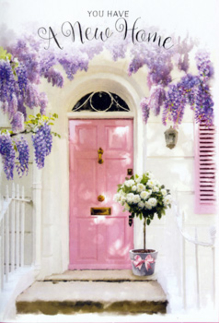 This image portrays a Mayfair townhouse entrance transformed into a softly romantic celebration of arrival. At the centre stands a pale pink front door, painted in a velvety, almost powdery shade that appears both refined and inviting, much like the elegant facades around Bond Street and Green Park. Above and around the doorway, an abundance of wisteria cascades in layered curtains of lavender and soft purple, the blossoms hanging in pendulous clusters that brush against the whitewashed wall. Their trailing vines create an archway effect, as though nature itself is framing the threshold with a whisper of springtime. To one side, a pastel shutter catches the light, its muted colour harmonising beautifully with the door and the blossoms overhead. Resting right on the step, a grey tin bucket holds a generous arrangement of creamy white roses and fresh green foliage, each rose fully open, layered, and plush, suggesting absolute freshness and the careful hand of an experienced florist. A pink satin ribbon is tied neatly around the bucket, its trailing ends adding movement and a subtle sheen, perfectly echoing the pink tones of the door. Soft London daylight filters through the wisteria, casting delicate shadows on the stone step and creating a tranquil, almost storybook atmosphere. The composition feels like a quiet celebration of a new home in Mayfair-a floral housewarming gift placed just so, ready to greet the new owners as they cross the threshold for the first time. It conveys calm joy, gentle nerves, and the comforting sense that this entrance is ready to witness many cherished moments to come.